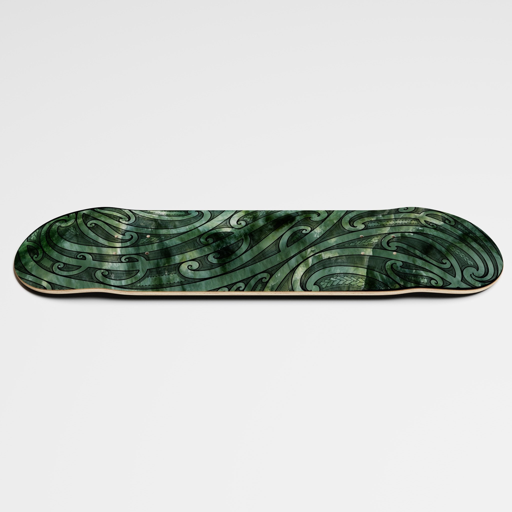 Horizontal photo of Maori Māna Skateboard Deck from MJC tā moko and Postal Skateboards collective collaboration 